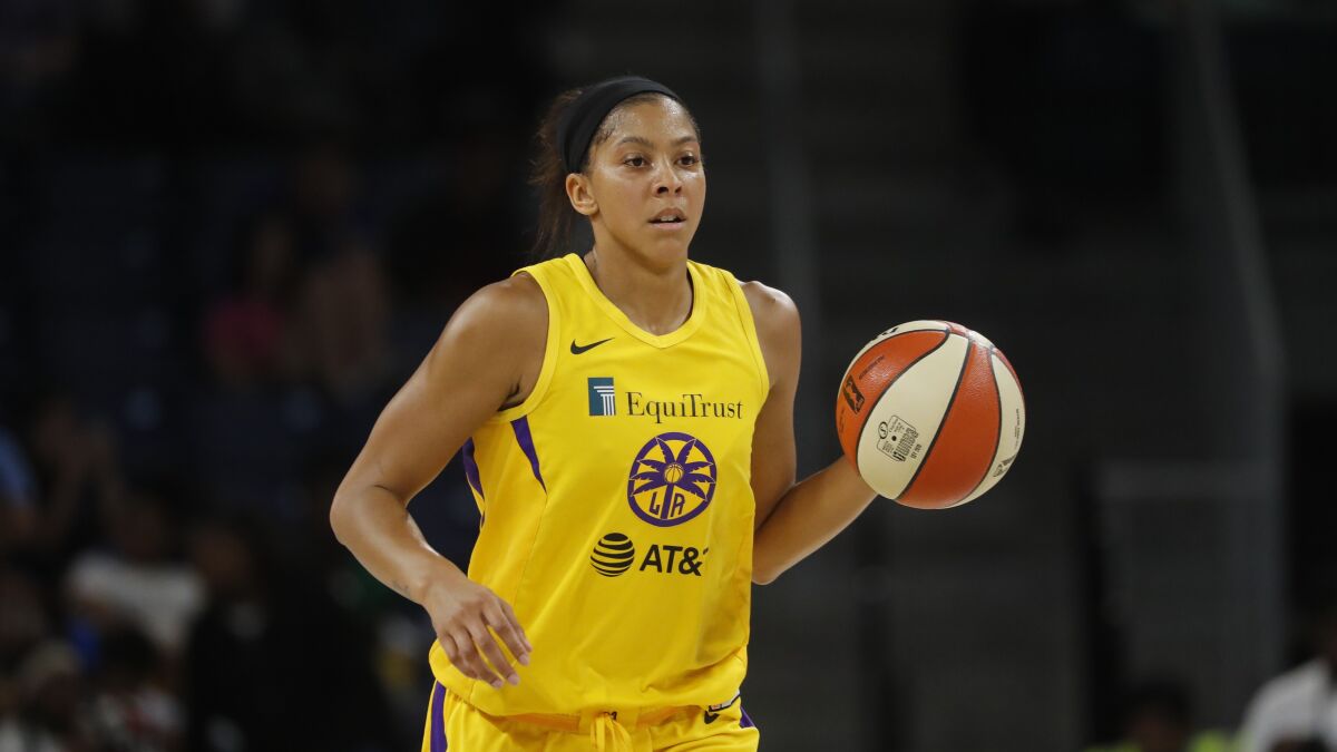Sparks center Candace Parker brings the ball up court during a game against the Chicago Sky earlier this season.