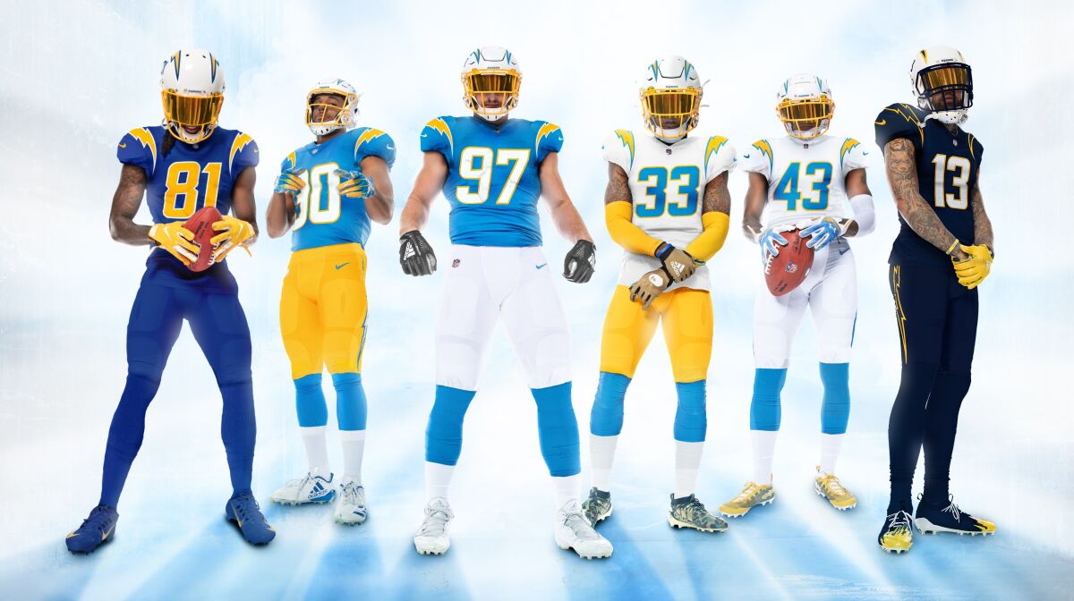 Chargers players show off the team's new uniforms for the 2020 season.