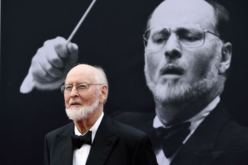 FILE - In this June 9, 2016, file photo, composer John Williams poses on the red carpet at the 2016 AFI Life Achievement Award Gala Tribute to John Williams at the Dolby Theatre in Los Angeles. In a YouTube video posted July 16, 2016, Williams greets two fans who played the theme from "Star Wars" on the sidewalk in front of his Los Angeles home. (Photo by Chris Pizzello/Invision/AP, File)
