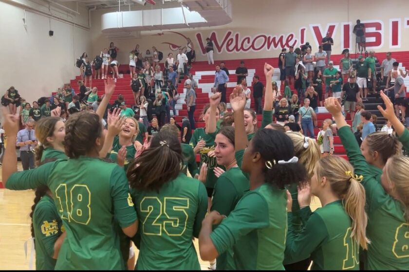 The Mira Costa girls' volleyball team celebrates their five-set win over Redondo Union on Sept. 27, 2022.