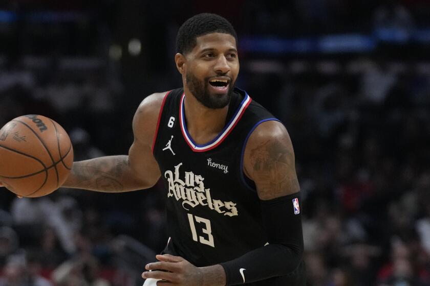 Los Angeles Clippers guard Paul George (13) controls the ball during an NBA basketball game against the San Antonio Spurs in Los Angeles, Thursday, Jan. 26, 2023. (AP Photo/Ashley Landis)