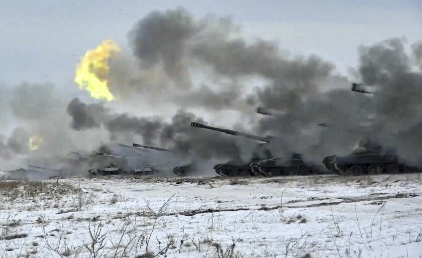 FILE - In this image taken from video and released by Russian Defense Ministry Press Service, Russian army's self-propelled howitzers fire during military drills near Orenburg in the Urals, Russia, Thursday, Dec. 16, 2021. With tens of thousands of Russian troops positioned near Ukraine, the Kremlin has kept the U.S. and its allies guessing about its next moves in the worst Russia-West security crisis since the Cold War. (Russian Defense Ministry Press Service via AP, File)