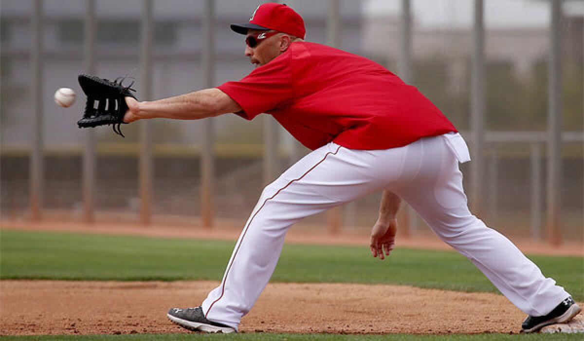 Angels designated hitter Raul Ibanez works on his first-base fielding skills during spring training Feb. 26 in Tempe, Ariz.