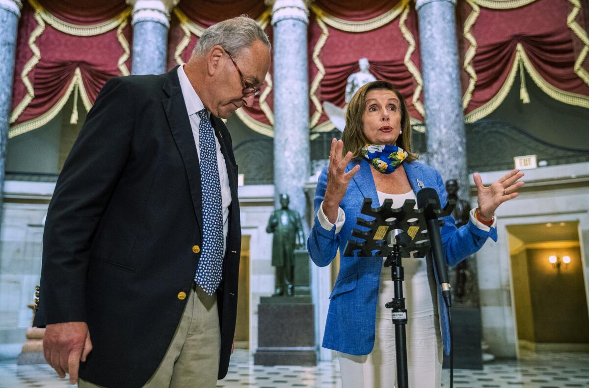 House Speaker Nancy Pelosi (D-San Francisco) and Senate Minority Leader Charles E. Schumer (D-N.Y.) speak to reporters.