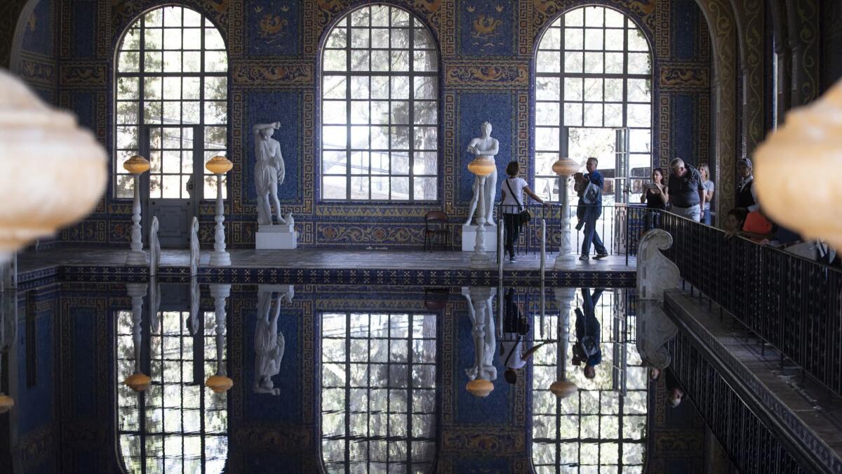 Tourists walk around the indoor Roman Pool at Hearst Castle in San Simeon.