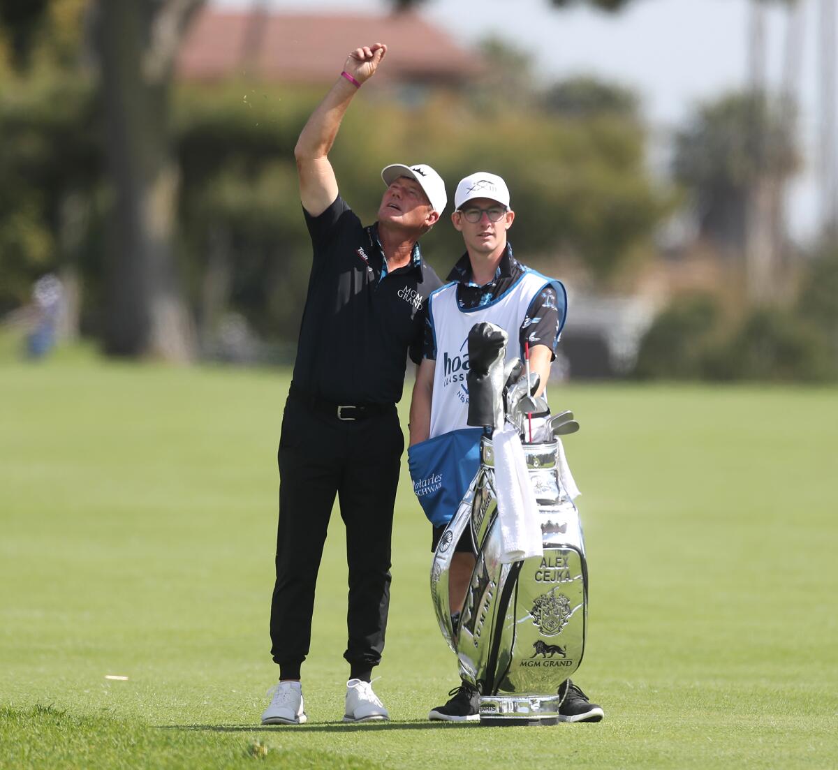 German player Alex Cejka checks the wind with his caddie on day one of the Hoag Classic on Friday.