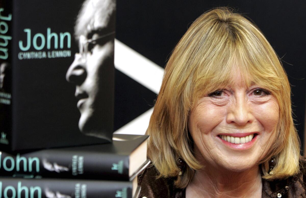 Cynthia Lennon, the first wife of Beatle John Lennon, sits behind copies of her newly released book entitled 'John' in 2005.