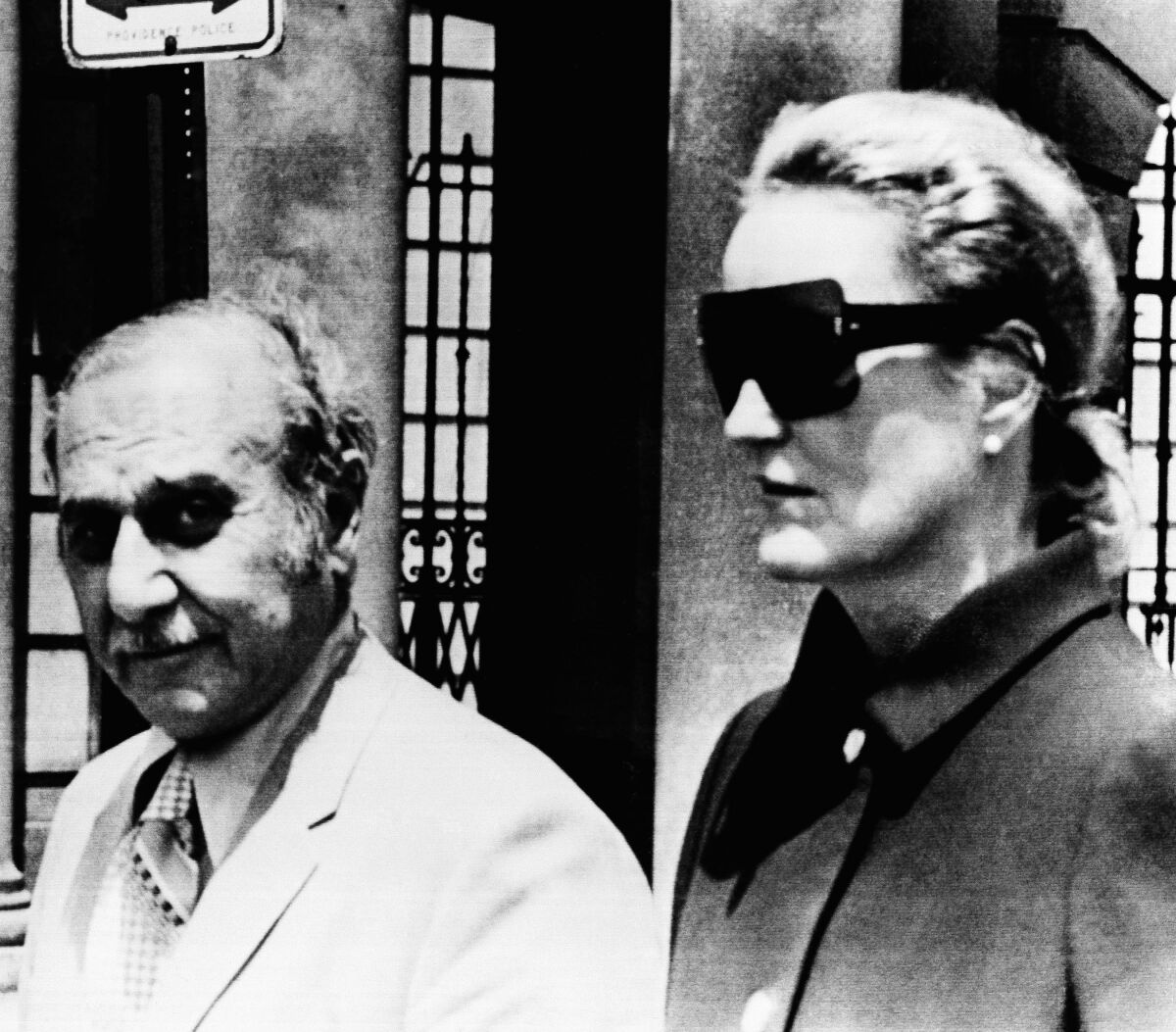 FILE - In this June 17, 1971 file photo, heiress Doris Duke and her attorney Aram Arabian, leave Superior Court in Providence, R.I. When Duke, the fabulously wealthy tobacco and power company heir, ran over and killed a longtime employee and confidant at her Newport, R.I. mansion in 1966, many people never bought the official police report that the death was an "unfortunate accident." Peter Lance's book "Homicide at Rough Point" released earlier this year concluded that Duke literally got away with murder in the death of Eduardo Tirella. (AP Photo, File)