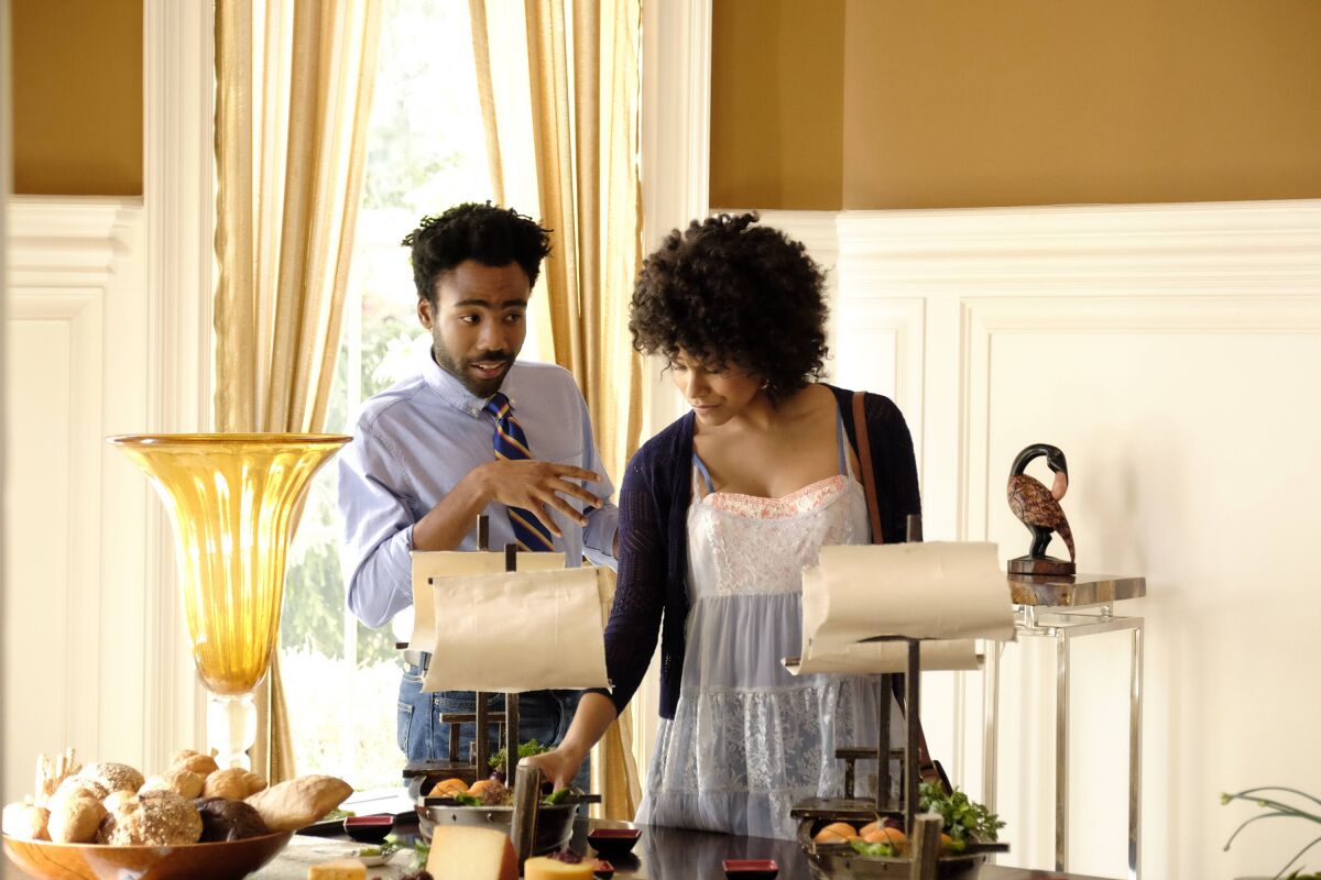 Donald Glover, left, and Zazie Beetz in FX's "Atlanta," one of several TV series to introduce Juneteenth to a wider audience.