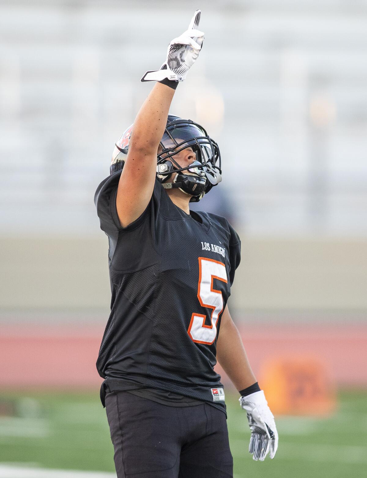 Los Amigos' Isaac Cuevas points to the sky after scoring against Ocean View during a nonleague football game.