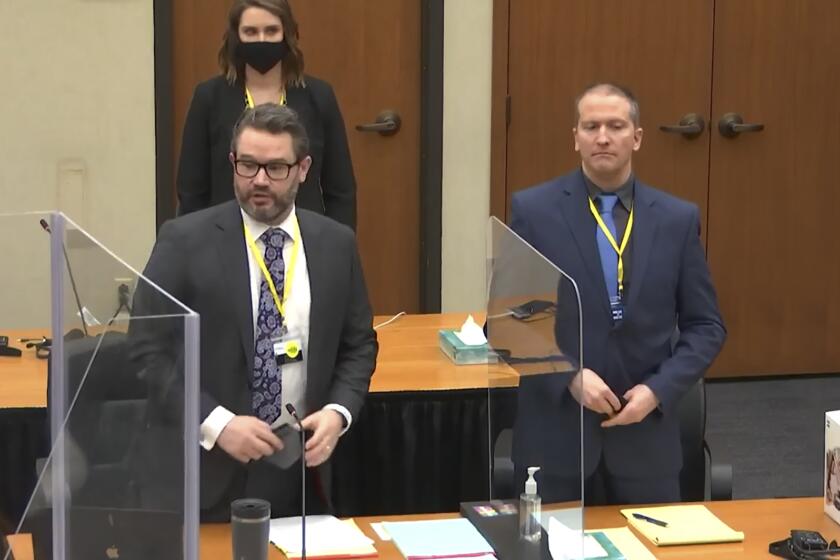 In this image taken from video, defense attorney Eric Nelson, left, and defendant former Minneapolis police officer Derek Chauvin, right, and Nelson's assistant Amy Voss, back, introduce themselves to potential jurors as Hennepin County Judge Peter Cahill presides, prior to continuing jury selection, Monday, March 15, 2021, in the trial of Chauvin, at the Hennepin County Courthouse in Minneapolis, Minn. Chauvin is charged in the May 25, 2020, death of George Floyd. (Court TV, Pool via AP)