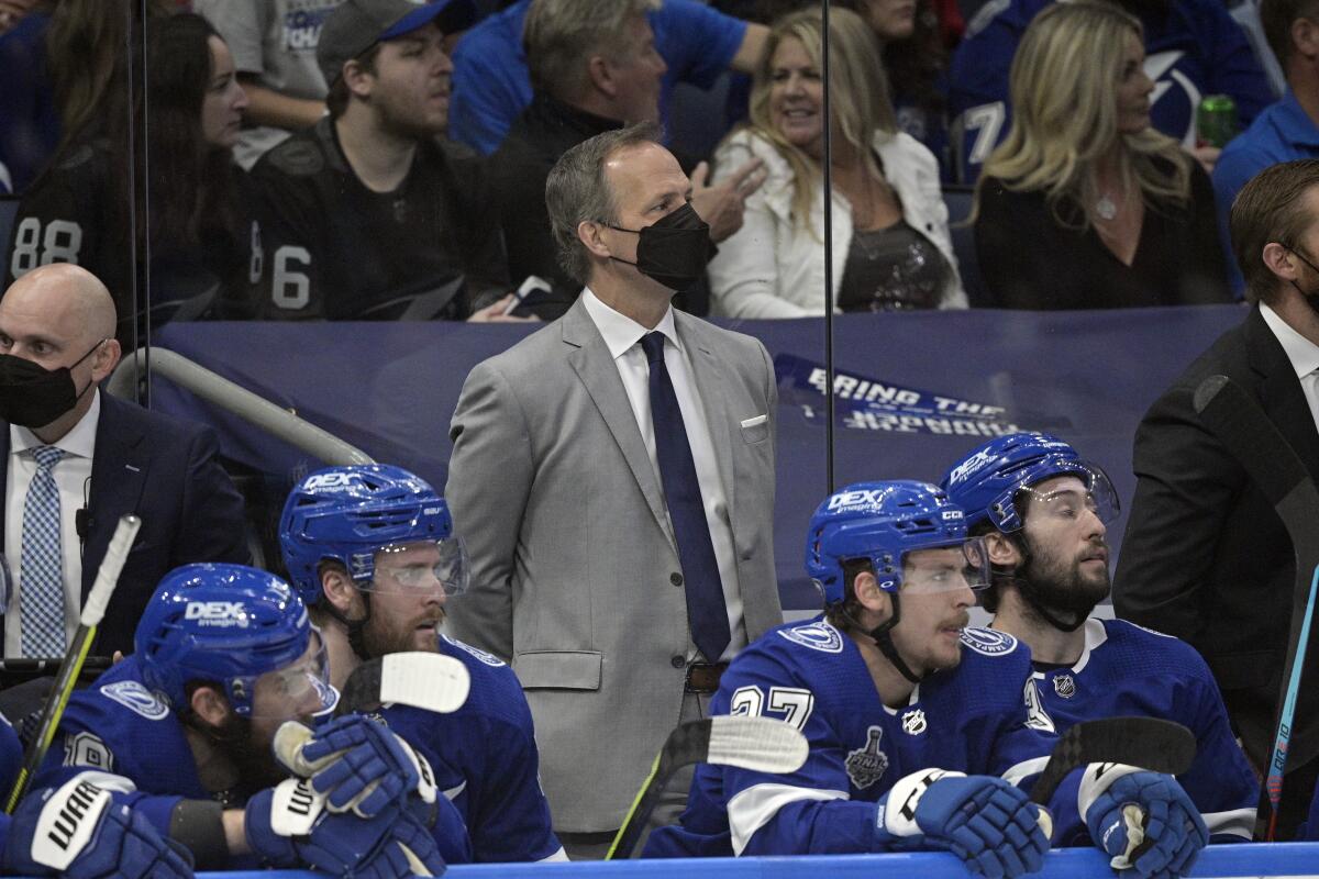 Tampa Bay Lightning head coach Jon Cooper watches from the bench during the first period in Game 2 of the NHL hockey Stanley Cup finals against the Montreal Canadiens, Wednesday, June 30, 2021, in Tampa, Fla. (AP Photo/Phelan Ebenhack)