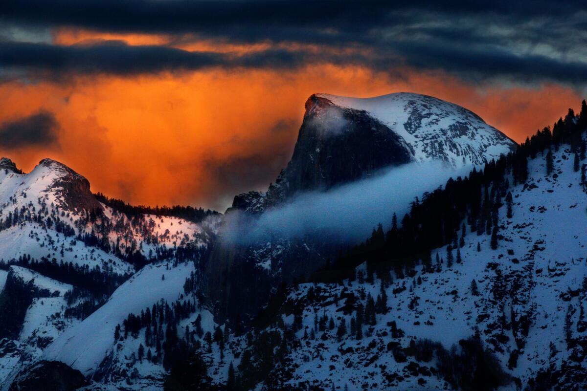 "Too many gray rocks." Yep, that's what one person thinks of Yosemite National Park, where the skies behind majestic Half Dome take on an eerie glow as the sun sets on another beautiful winter's day.