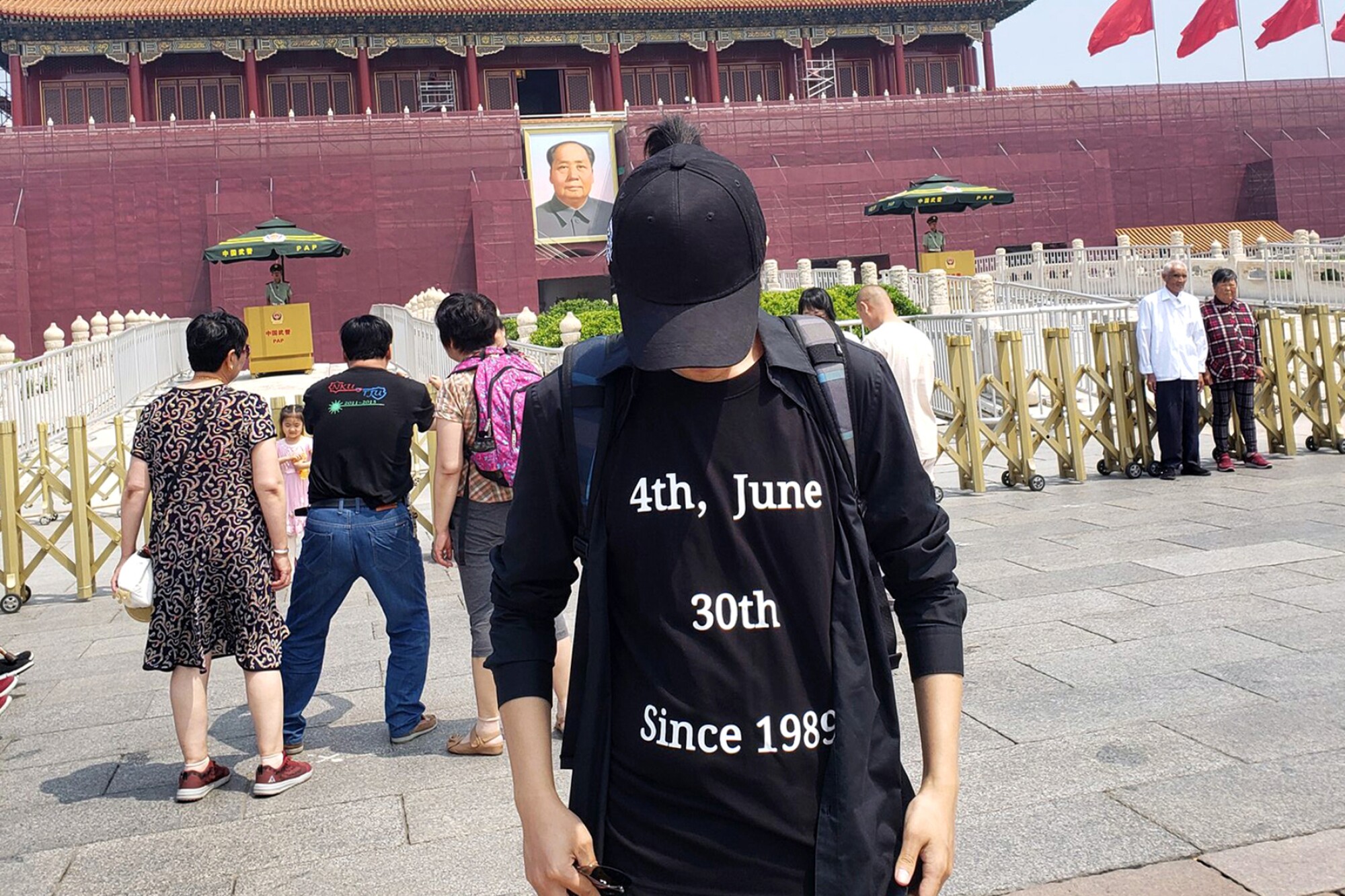 Dong Zehua stands in Tiananmen Square