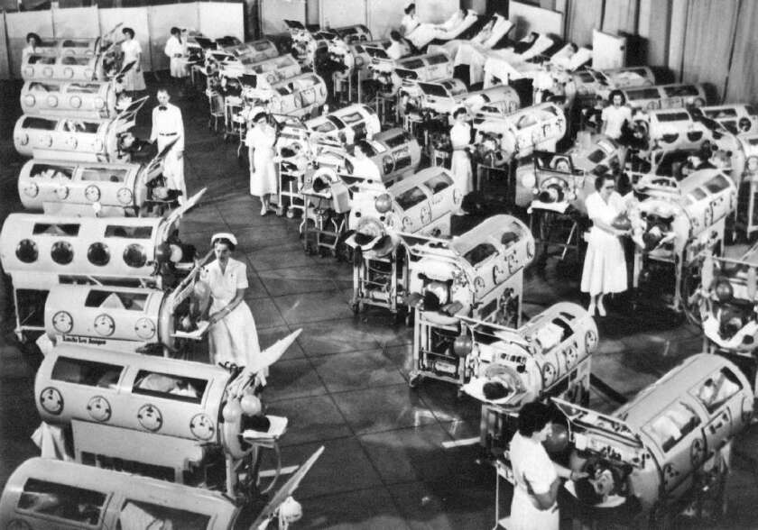 A photo from the 1940s or '50s shows a ward at Rancho Los Amigos Hospital in Downey filled with polio victims in iron lungs.
