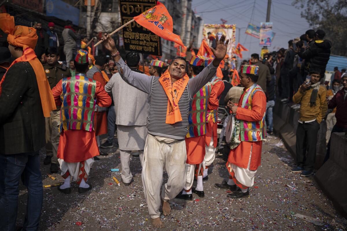 Devotees celebrating the planned opening of a massive Hindu temple in Ayodhya, India