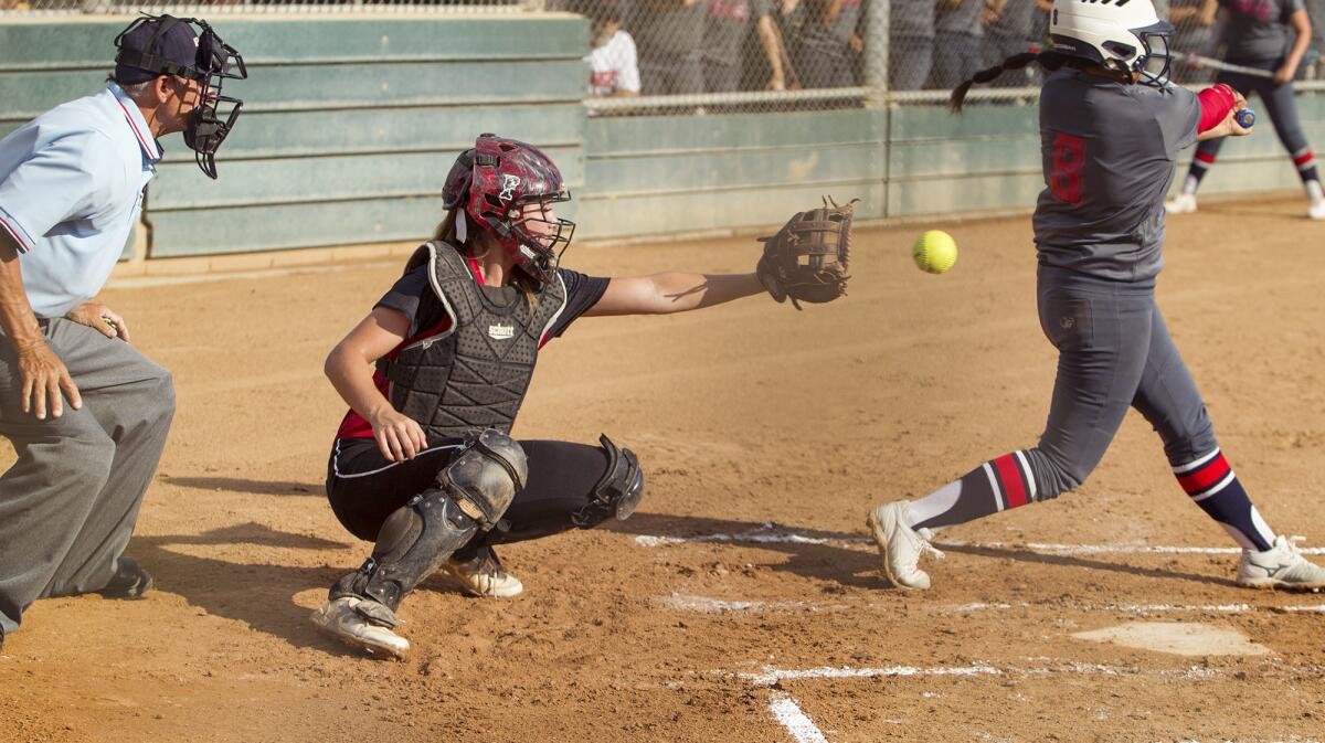 Madeline Domingo catches for the Lakewood Firecrackers in a Premier Girls Fastpitch Nationals 18U Platinum Division game against the Monarchs at Fountain Valley Sports Park on Thursday.