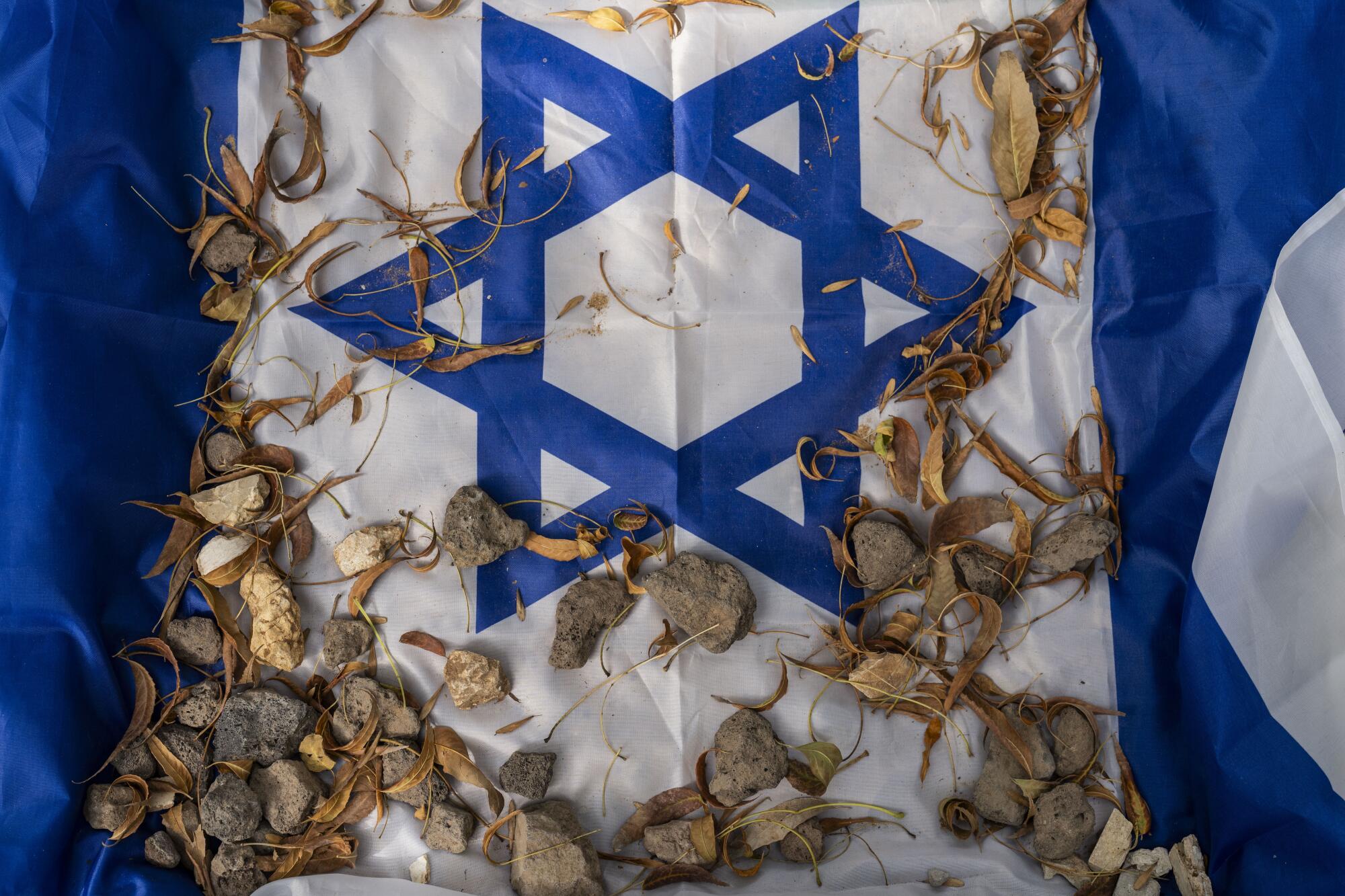 Stones on a blue-and-white flag with a blue star in the center