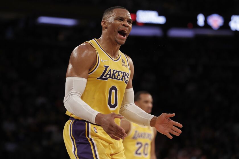 Los Angeles Lakers guard Russell Westbrook (0) reacts after a call from the officials late in the second half of an NBA basketball game against the New York Knicks on Tuesday, Nov. 23, 2021, in New York. (AP Photo/Jim McIsaac)