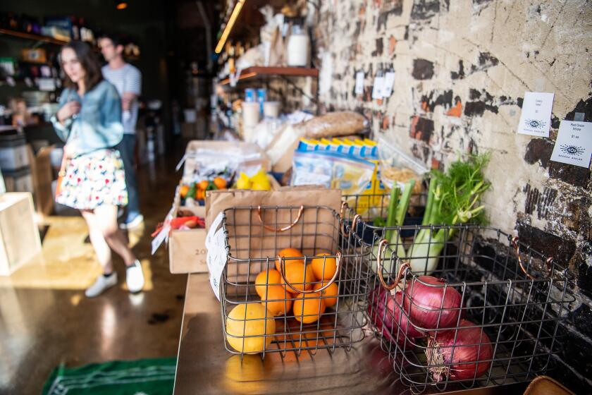 LOS ANGELES, CA- March 27, 2020: As the Coronavirus continues to spread, Bar Avalon & Eve Bottle Shop is trying to adapt by becoming Bodega Avalon, offering prepared take home food, canned goods as well as fresh produce on Friday, March 27, 2020. (Mariah Tauger / Los Angeles Times)