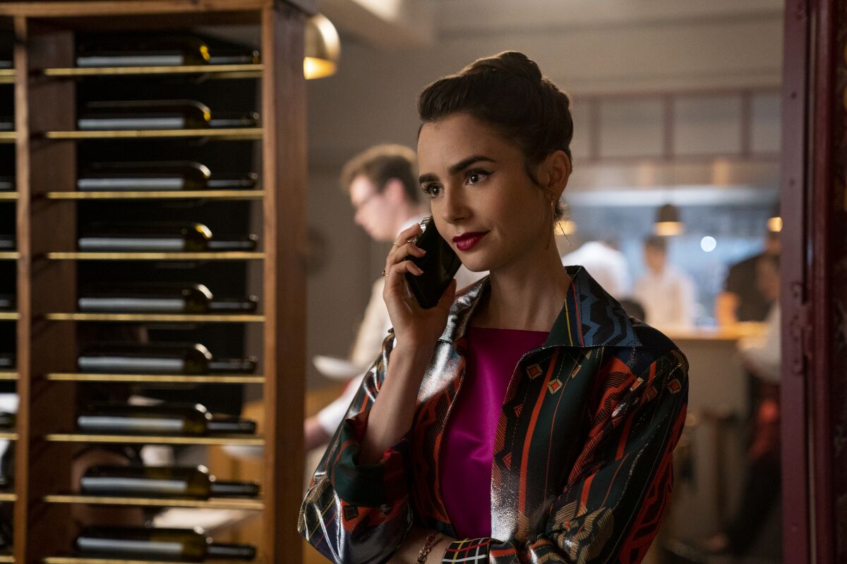 A fashionable young woman on a phone call.