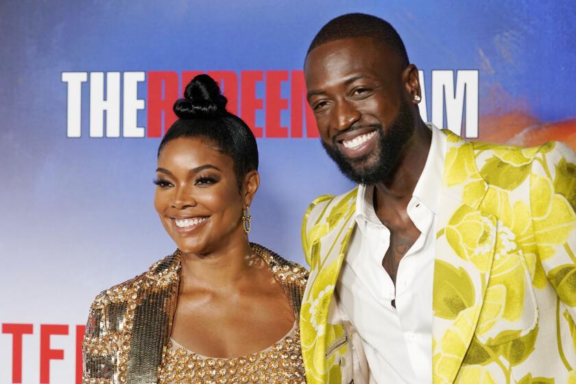 Dwyane Wade and his wife Gabrielle Union pose together at a special screening of the Netflix documentary film "The Redeem Team," Thursday, Sept. 22, 2022, at the Netflix Tudum Theater in Los Angeles. (AP Photo/Chris Pizzello)