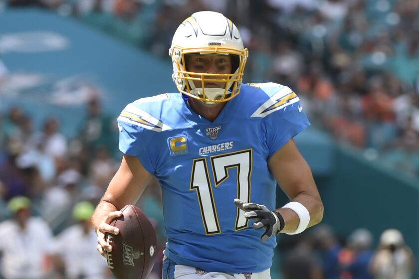 MIAMI, FL - SEPTEMBER 29: Philip Rivers #17 of the Los Angeles Chargers scrambles in the first quarter of the game against the Miami Dolphins at Hard Rock Stadium on September 29, 2019 in Miami, Florida. (Photo by Eric Espada/Getty Images)