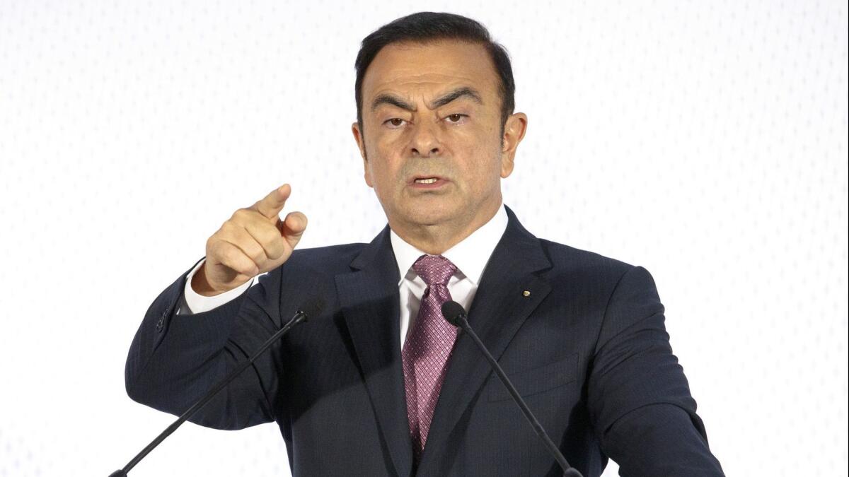 Carlos Ghosn addresses reporters during a news conference in Paris on Feb. 12, 2015.