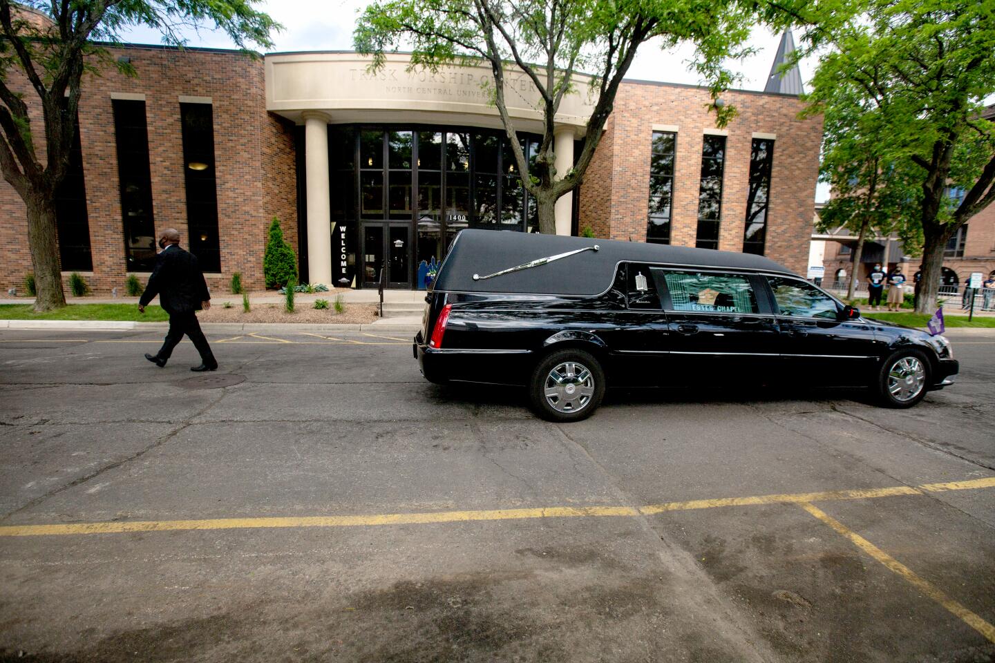 A hearse brings Floyd's casket to the Minneapolis service.