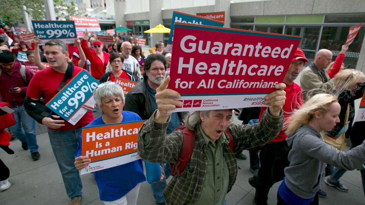 Supporters of single-payer healthcare march to the state Capitol on April 26 in Sacramento.