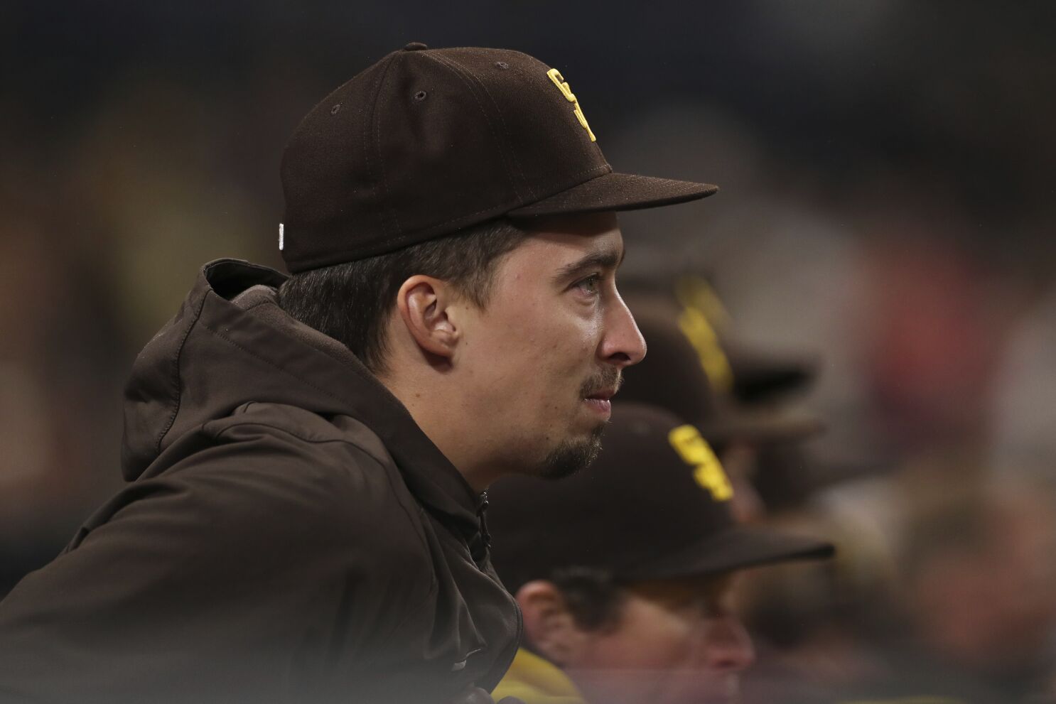 San Diego Padres second baseman Jake Cronenworth throws to first base for  an out in a baseball game against the Philadelphia Phillies, Saturday, June  25, 2022, in San Diego. (AP Photo/Derrick Tuskan