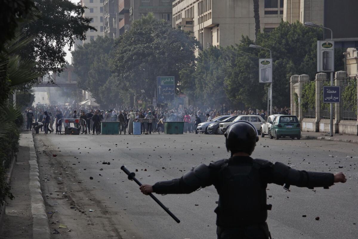 Supporters of Egypt's ousted President Mohamed Morsi confront security forces in Cairo last week.
