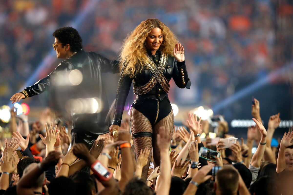Beyonce and Bruno Mars perform during the Pepsi Super Bowl 50 Halftime Show at Levi's Stadium.