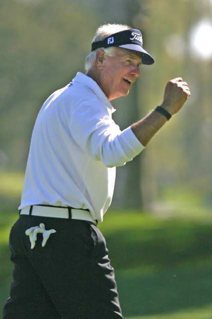 Professional golfer Bruce Fleisher congratulates a member of his group after a good shot at the Toshiba Classic Pro-Am at Newport Beach Country Club on Wednesday.