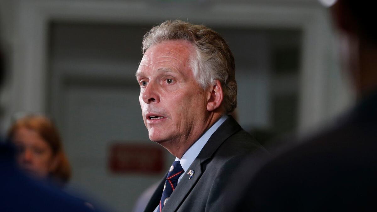 Virginia Gov. Terry McAuliffe, seen at a news conference about the weekend events in Charlottesville, has ACA marketplace problems to deal with too.