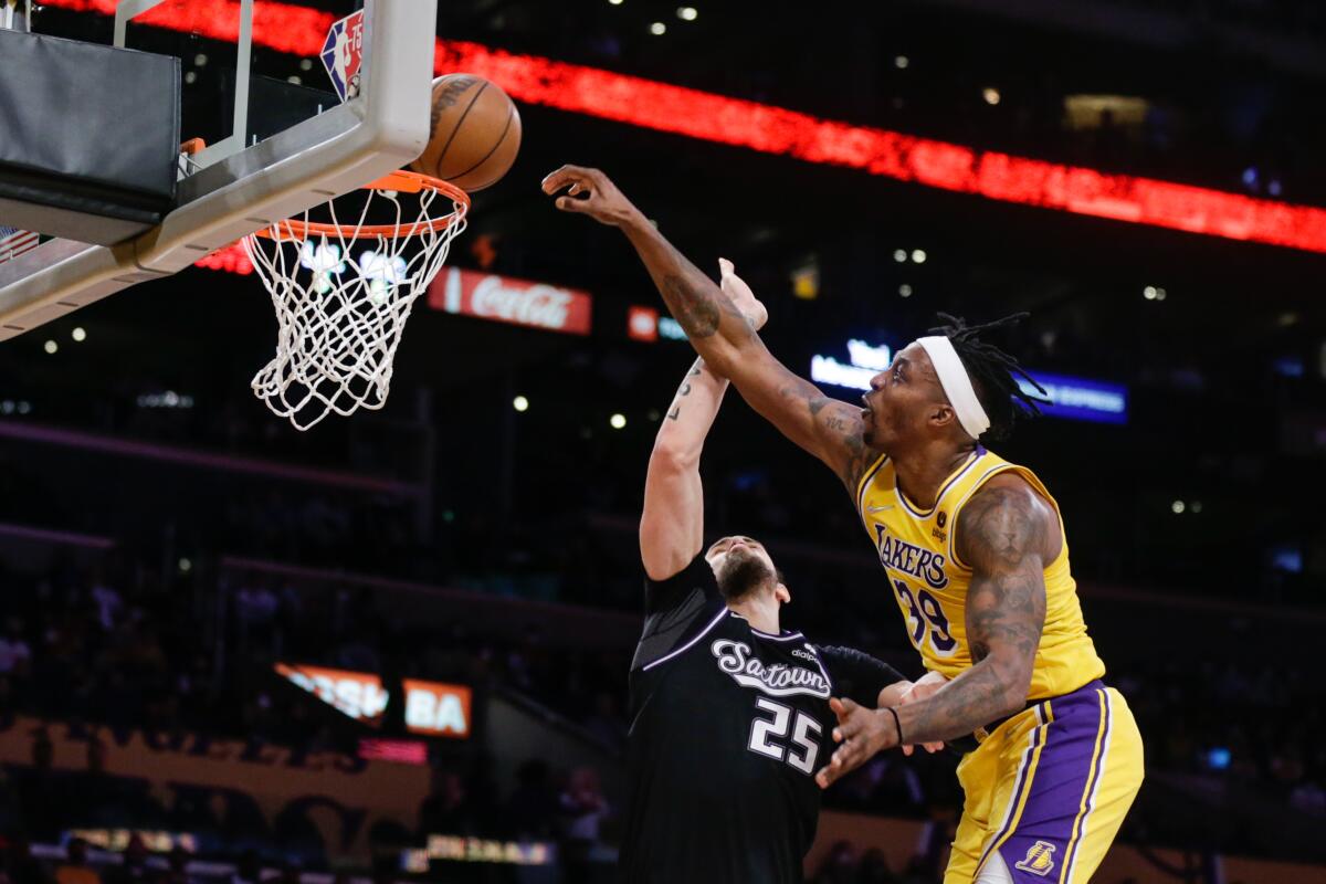 Lakers center Dwight Howard attempts a dunk on Sacramento Kings center Alex Len.