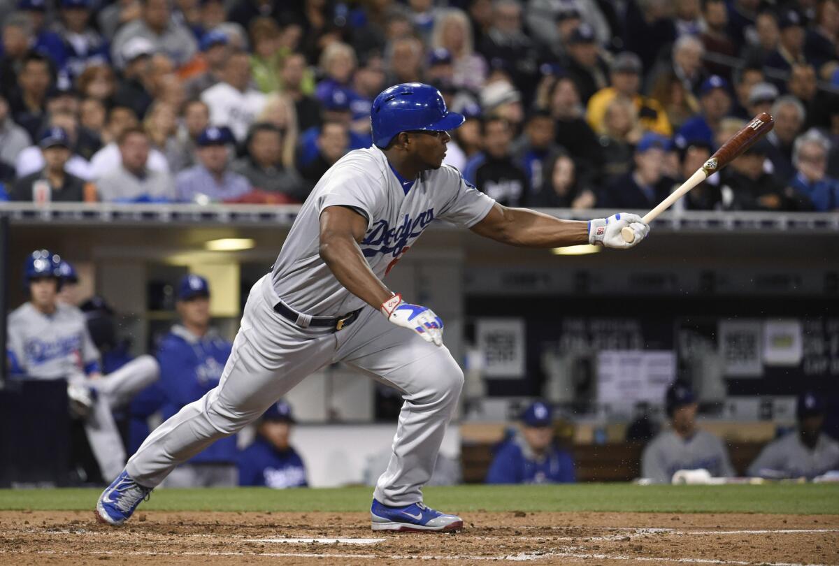 Dodgers right fielder Yasiel Puig leaves the batter's box while grounding out against the Padres on April 24 in San Diego. Puig reinjured his left hamstring on the play.