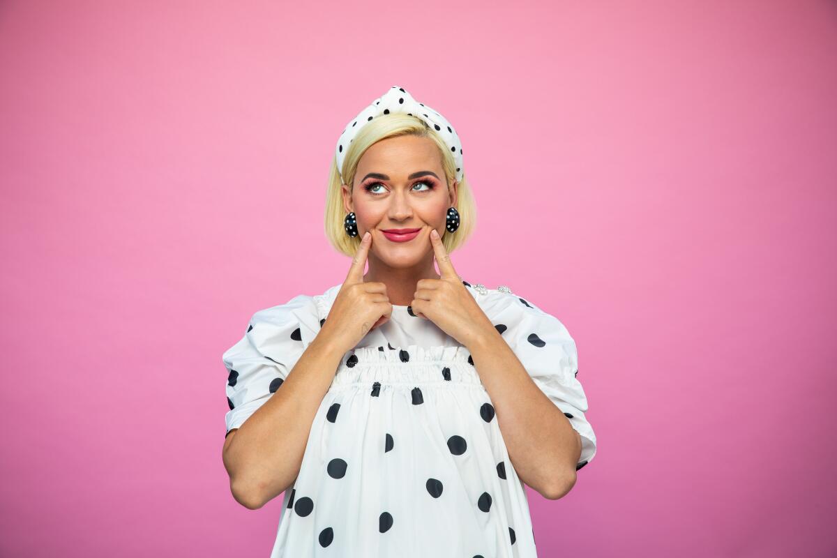 Katy Perry is about to give birth to her first child and her fifth album, "Smile."