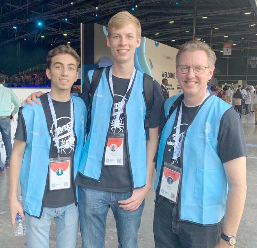 Ramona Unified School District Trustee Rodger Dohm, right, provides guidance to his Poway High School students at a robotics event. Students shown are Suhail Saqan, left, and Ethan Champion. They are participating in the FIRST Global Robotics Competition in Dubai, United Arab Emirates.