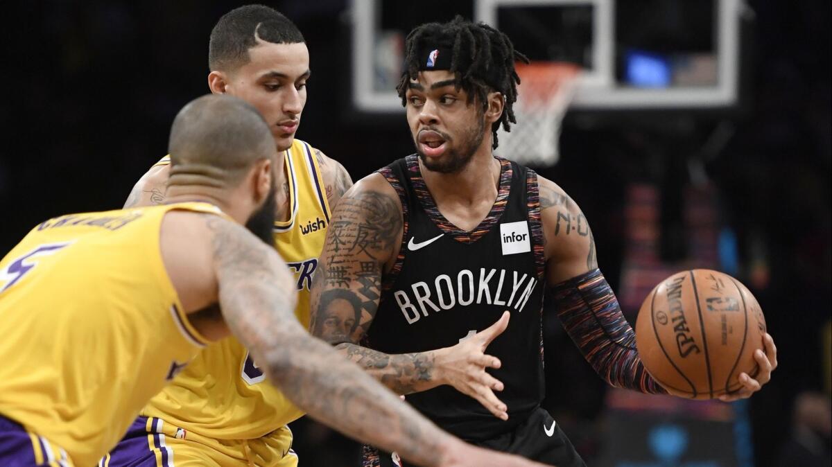 D'Angelo Russell of the Brooklyn Nets dribbles around the Lakers' defense during the third quarter of their game at Barclays Center on Dec. 18.