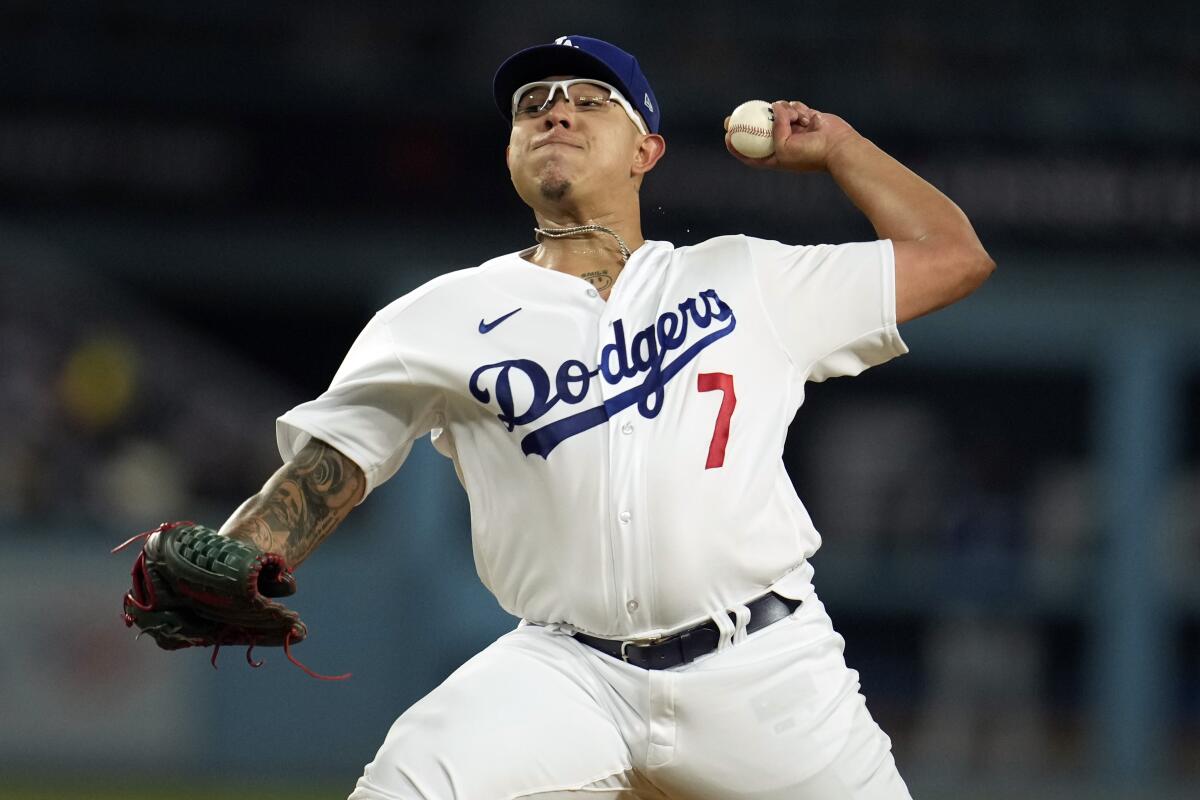 Dodgers pitcher Julio Urías throws to a Colorado Rockies batter during the second inning at Dodger Stadium.