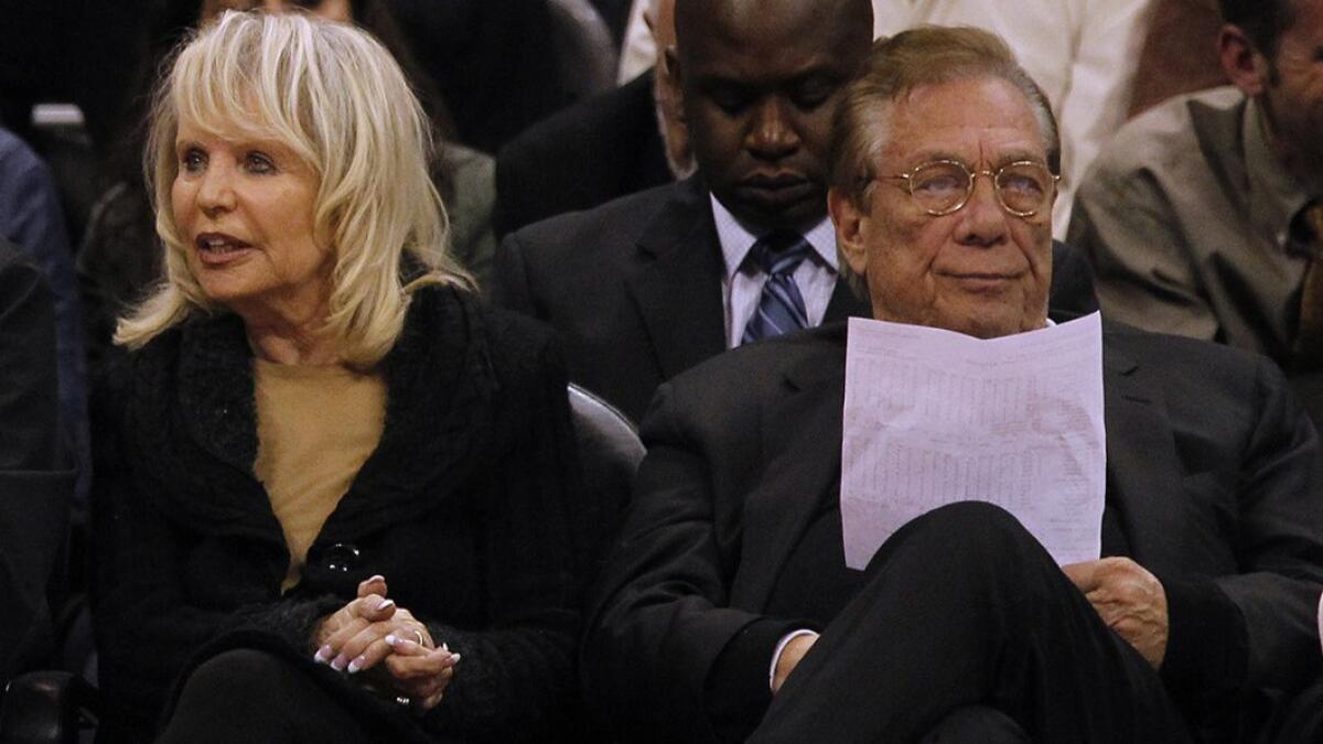 Clippers owners Shelly, left, and Donald Sterling attend a game between the Clippers and Washington Wizards at Staples Center in 2011. Donald Sterling's lawyers say he should be an acting trustee of the family's holdings.
