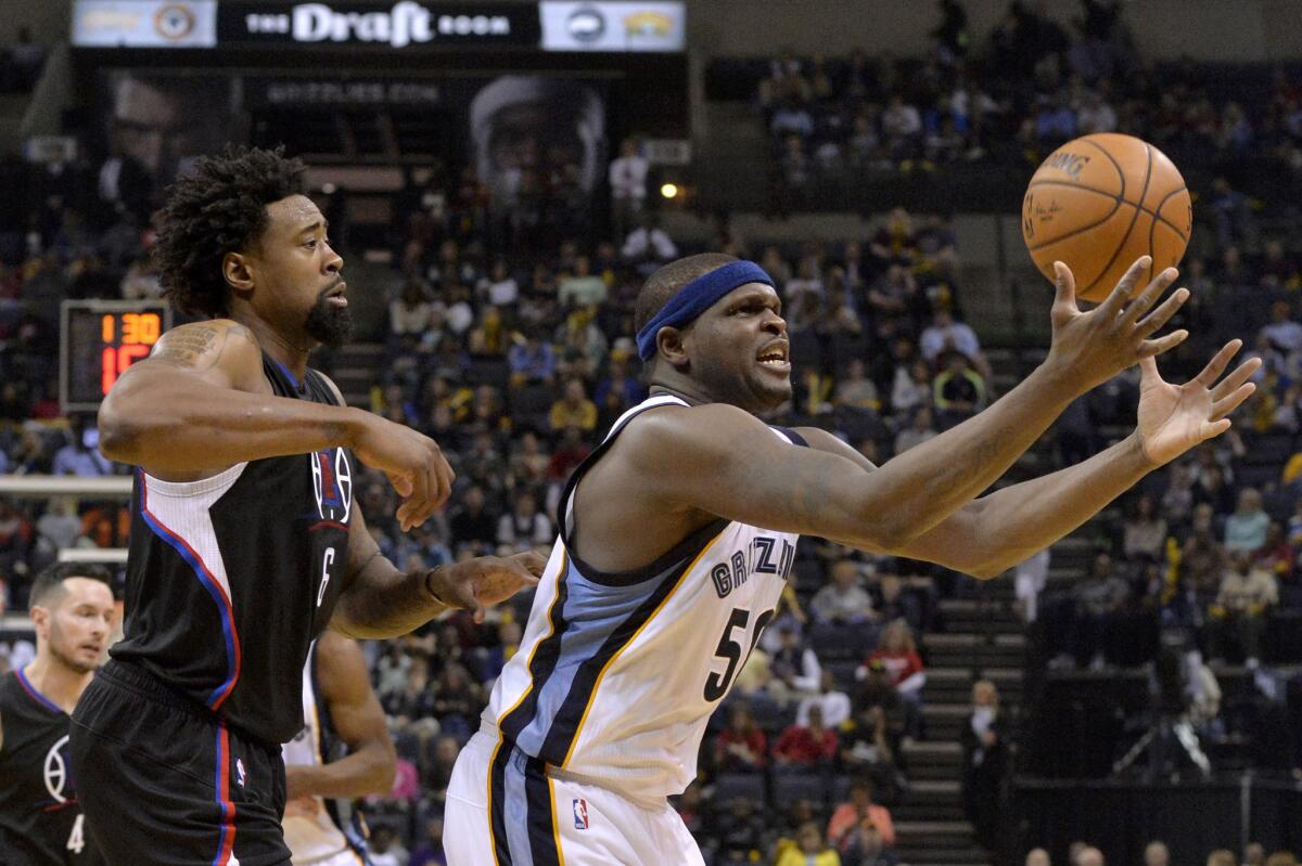 Grizzlies forward Zach Randolph grabs the ball in front of Clippers big man DeAndre Jordan during the second half of a game on March 19.