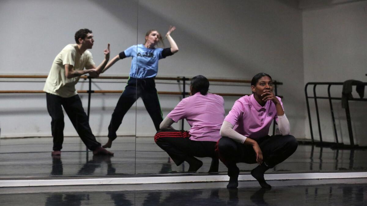 Micaela Taylor watches dancers Matt Luck and Elizabeth Finfgeld during the TL Collective rehearsal for their performance at Ford Theatres.