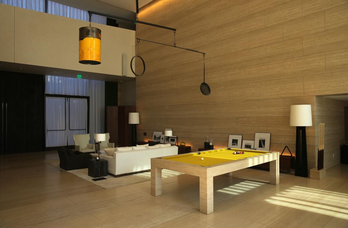 A yellow felt pool table in the lobby area of the new Edition Hotel in West Hollywood.