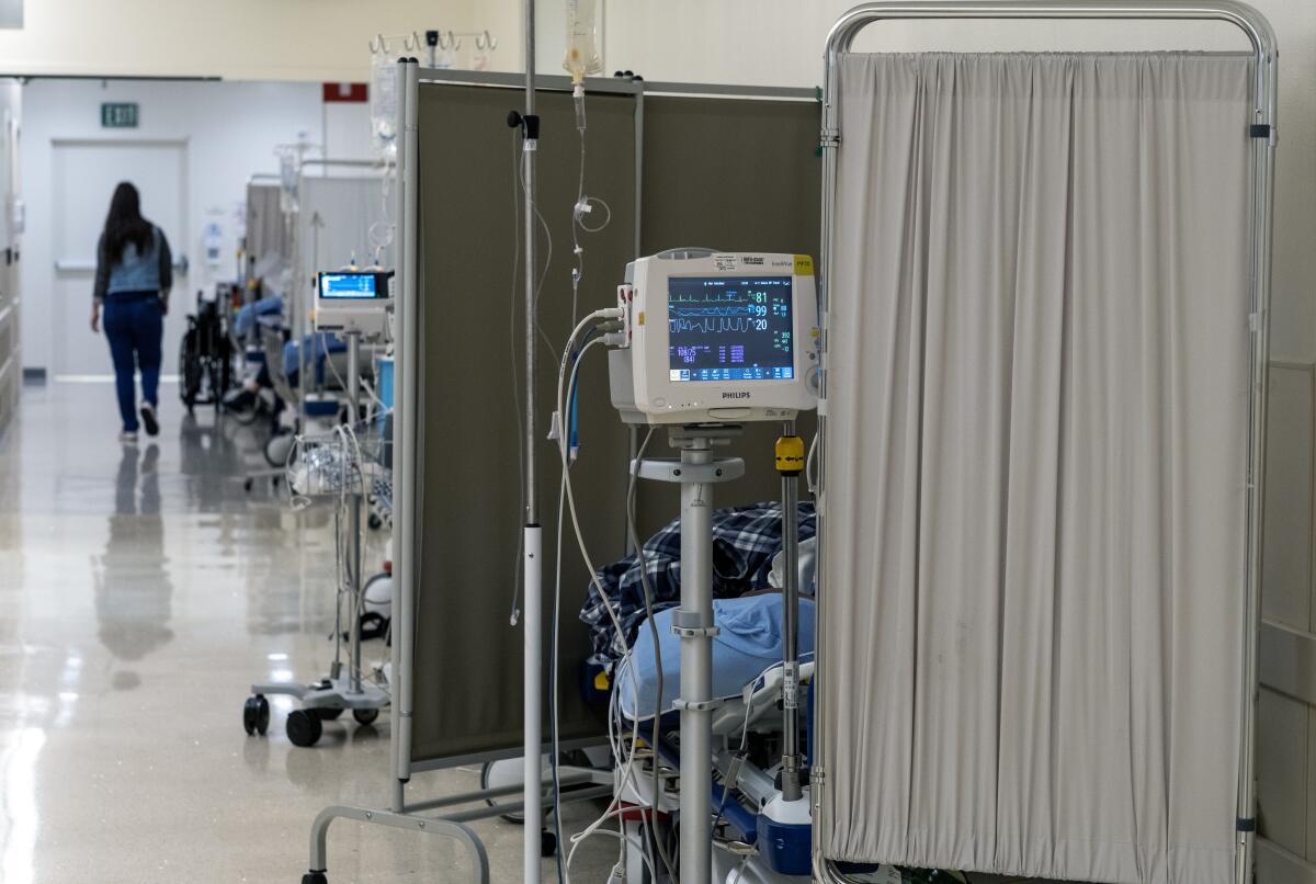 Patients lie on gurneys inside the emergency department at MLK Community Hospital in Willowbrook on Jan. 2.