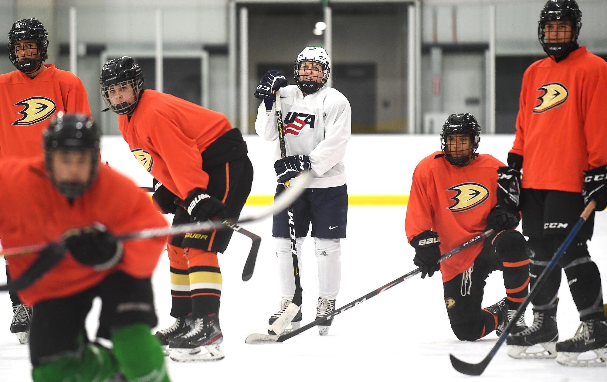 Kendall Coyne Schofield practices with the Ducks' under-16 boys team at Great Park Ice in Irvine.