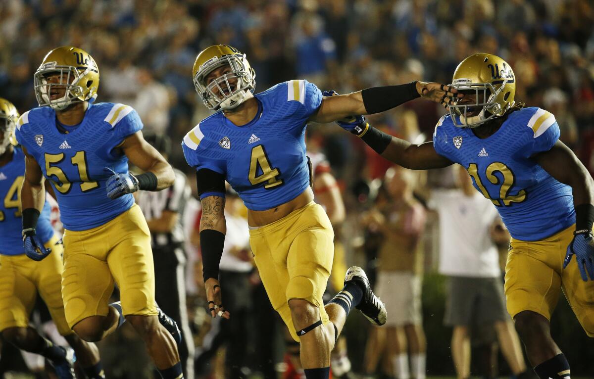 UCLA linebackers Cameron Judge (4) and Aaron Wallace (51) are battling for one of the Bruins' few undetermined starting roles.