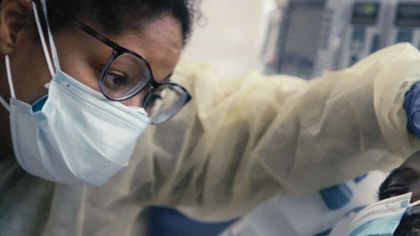 A close-up of a medical practitioner from "The First Wave. 