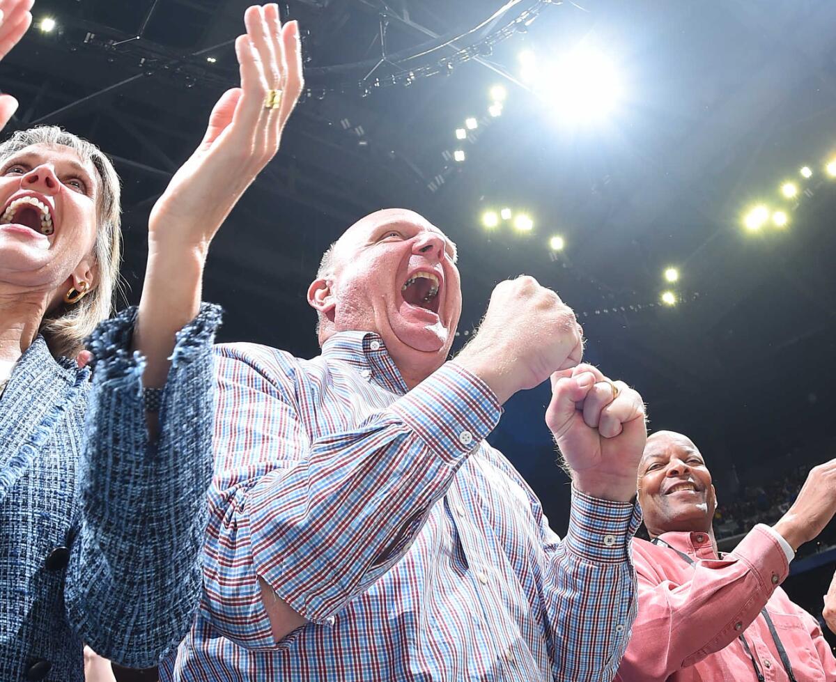 Connie and Steve Ballmer cheer for the Clippers during a season-opening win over the Lakers in October.